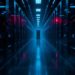 Data center corridor with blue-lit server racks on both sides, fading toward a glowing doorway at the far end.