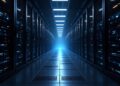 Long corridor of server racks with blue LED lights, fading to a bright blue glow at the end.